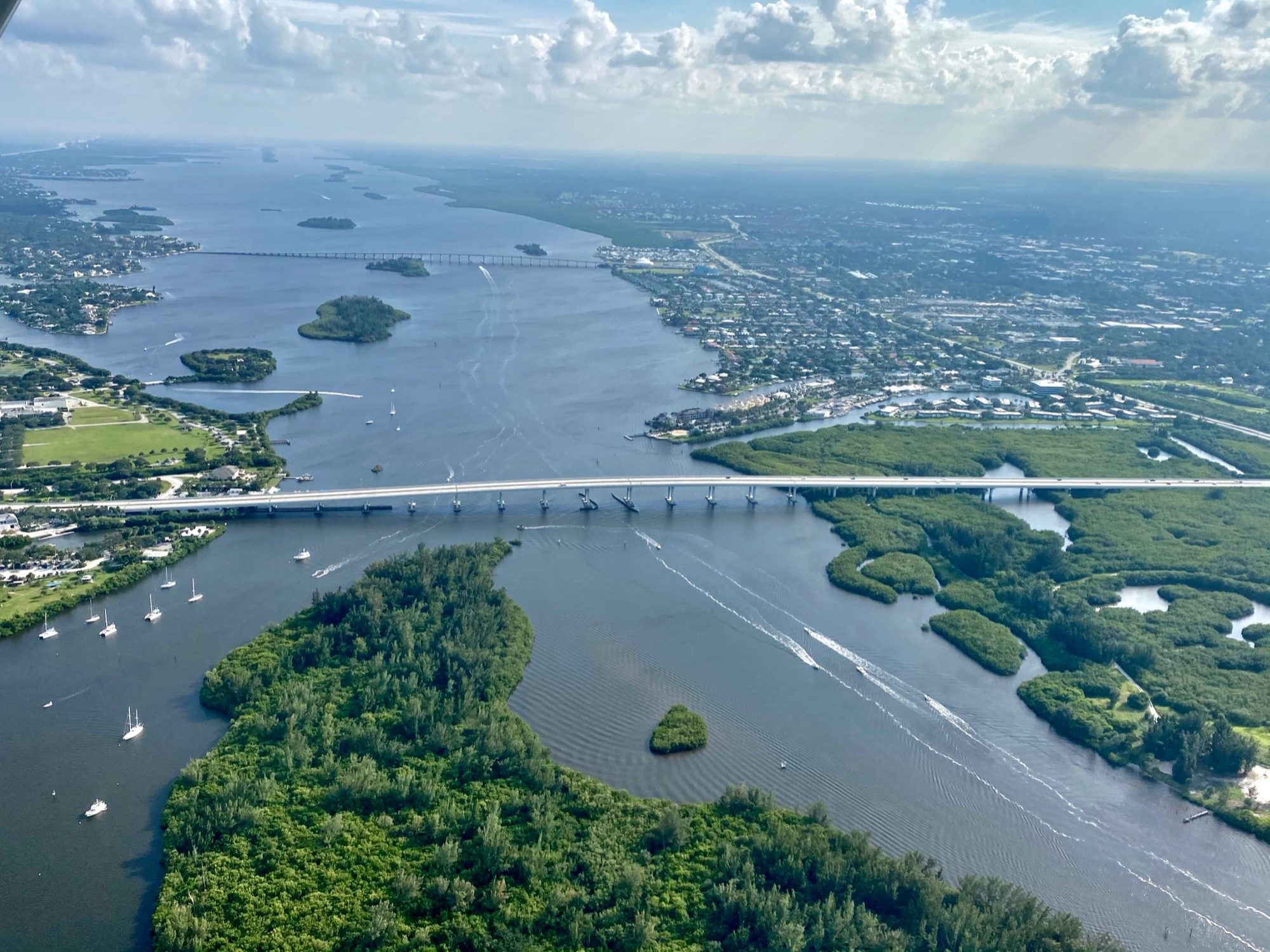 Aerial view of the Florida intracoastal waterway with boats and greenery