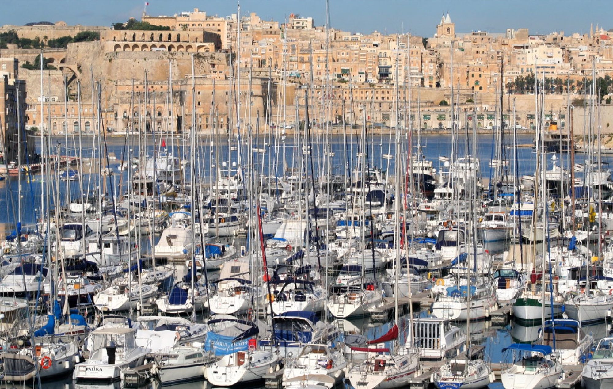 Marina full of yachts and sailboats along the waterfront