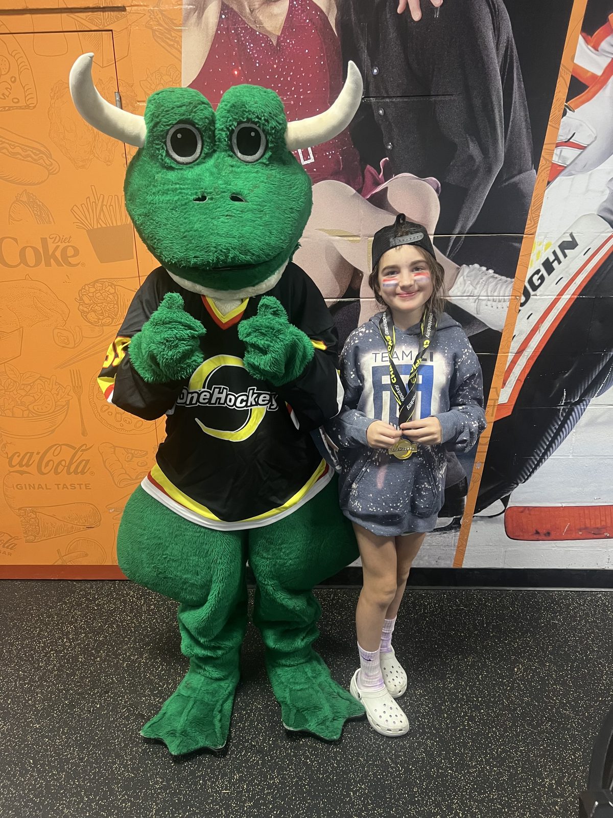 OneHockey player with Freddie the mascot