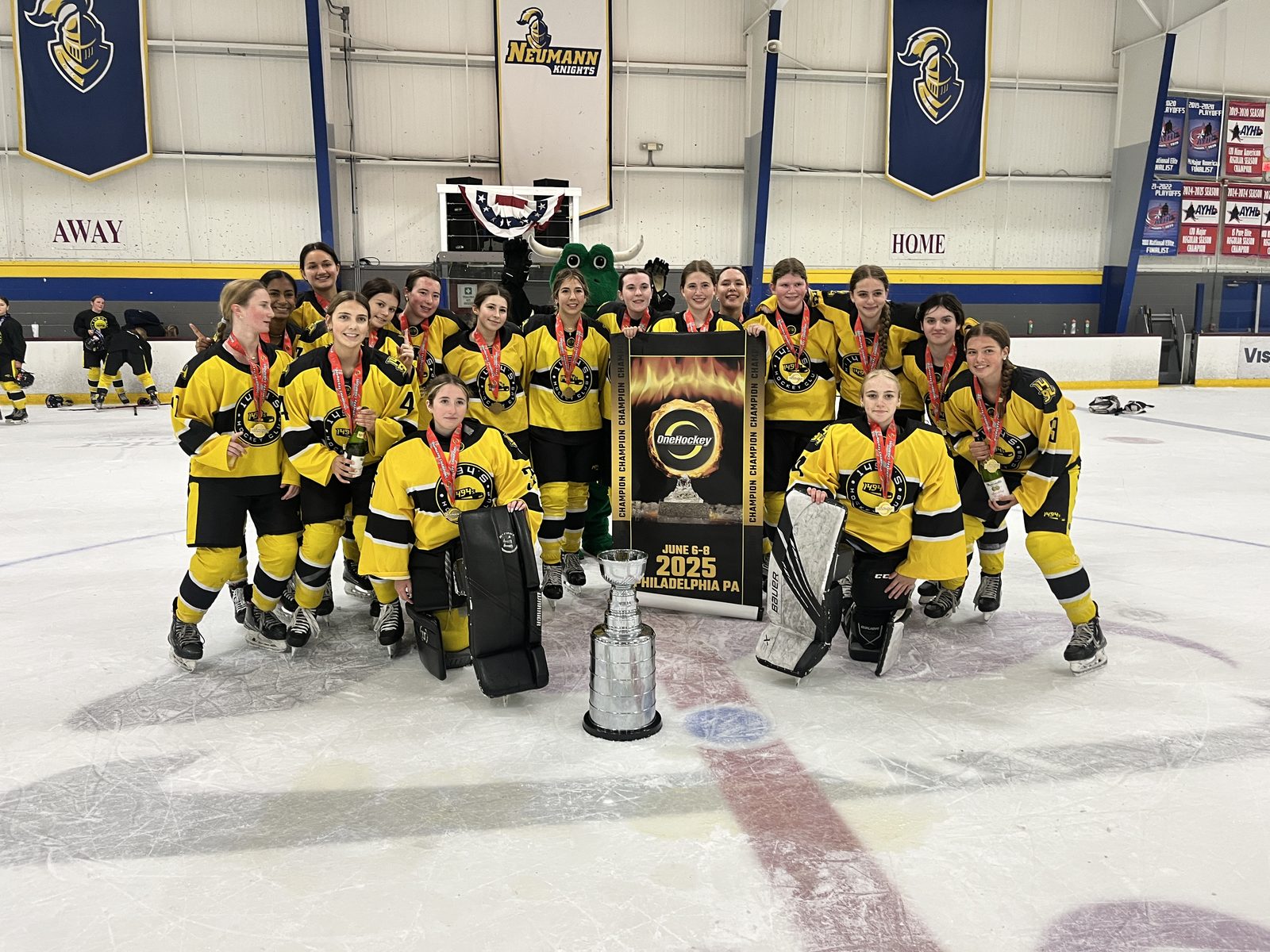OneHockey champions on the ice with the trophy and mascot