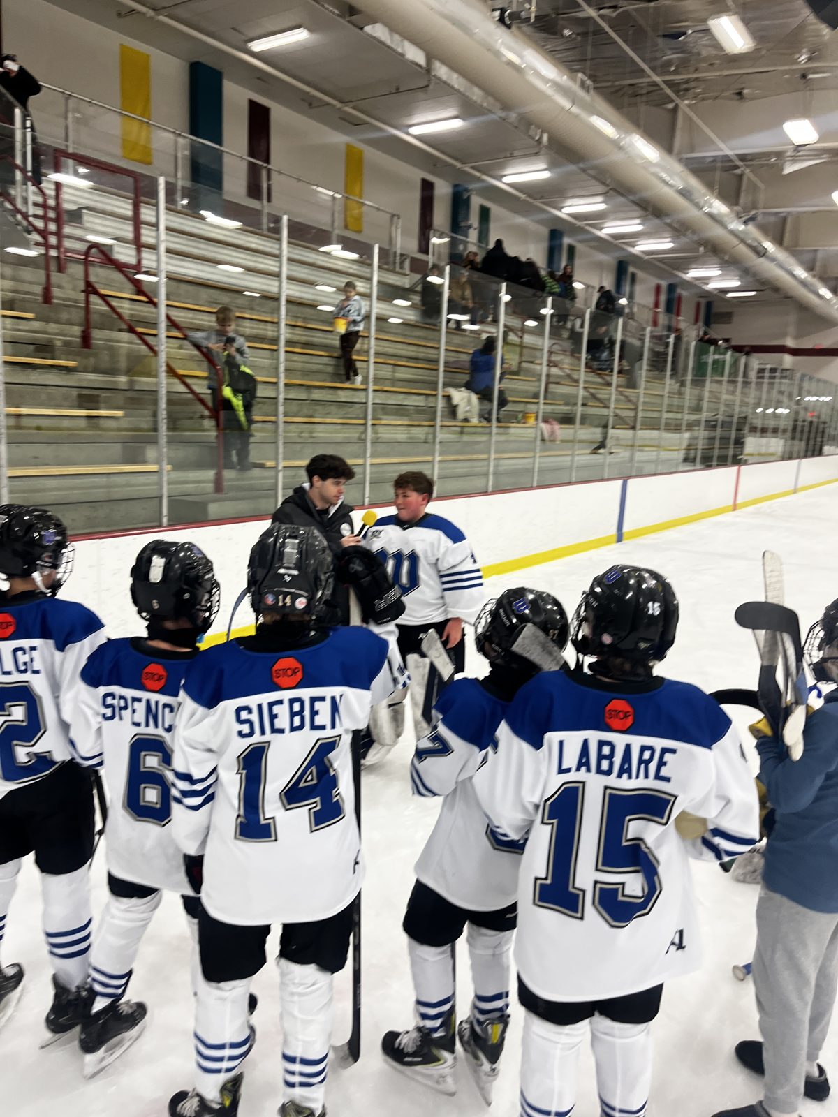 OneHockey youth team celebrating on the ice