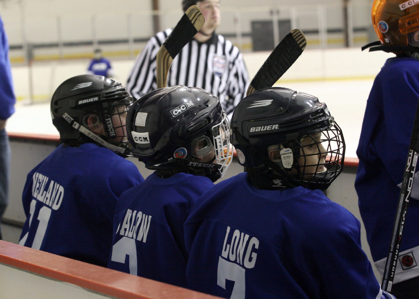 Youth players on the bench during a game